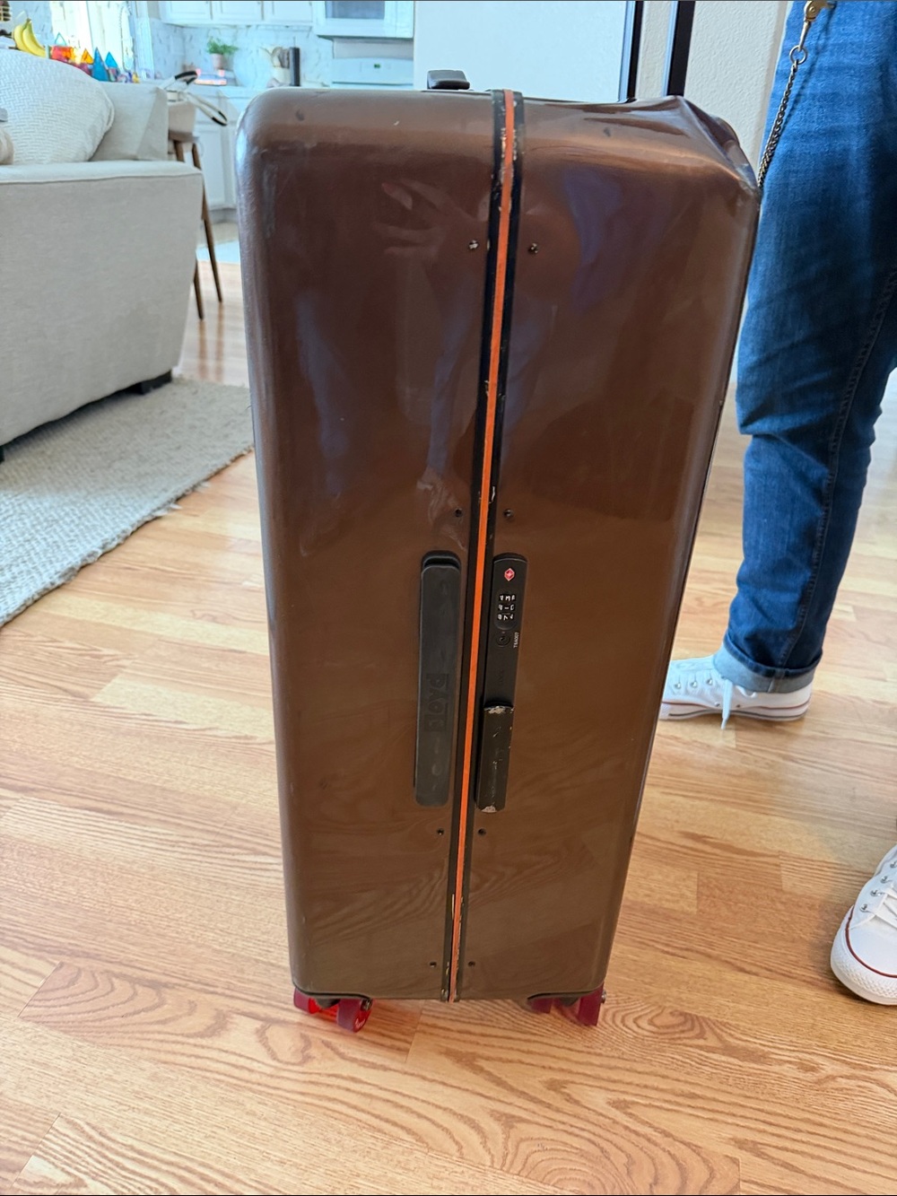 Floyd Brown Hardshell Suitcase with Bright Orange Interior and Red Wheels - Picture 8 of 17